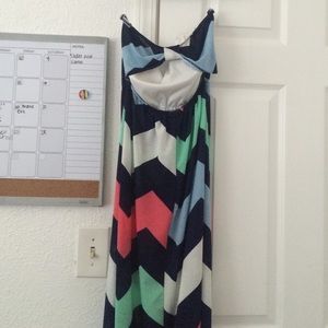 Long chevron strapless dress with bow cut out