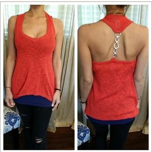 red knit top with chain in back