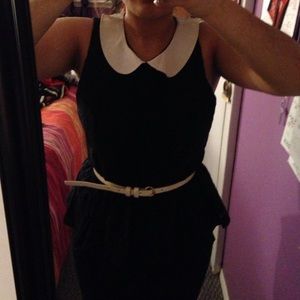 A "Wednesday" type peplum style shirt.