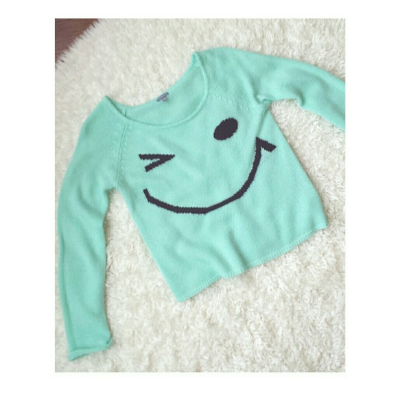 Teal winky face sweater