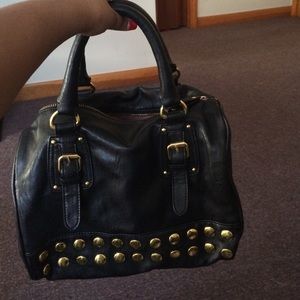 Gold studded black purse