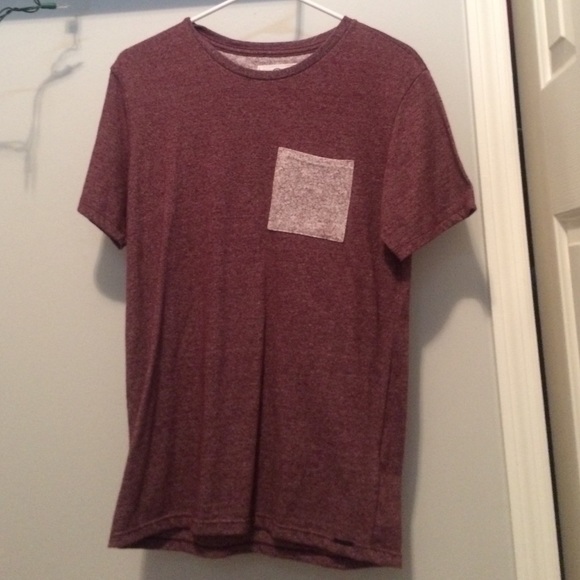 a short sleeve shirt.maroon speckled with a pocket