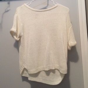 a sheer white crop top