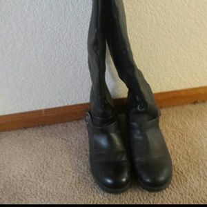 Black knee high boots.