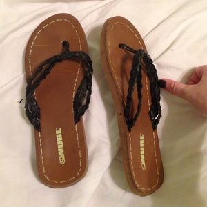 Brown and black flip-flops