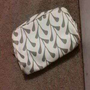 Green and cream clinique makeup bag.