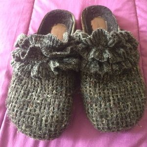 Black clogs with ruffles and lines