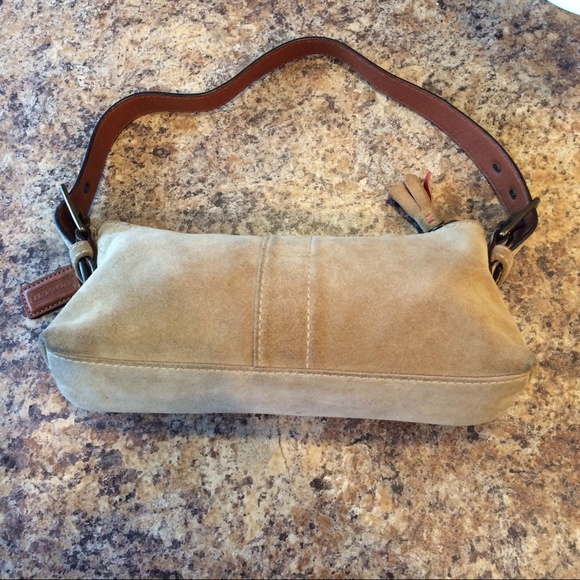 Small tan suede Coach bag.