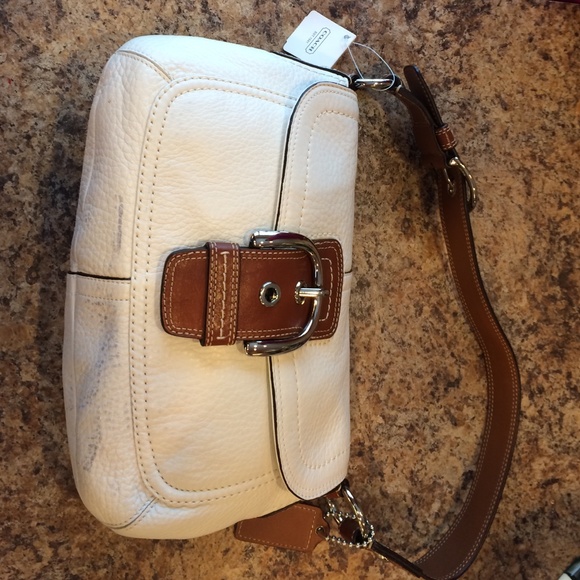 Brand new white/tan Coach purse.