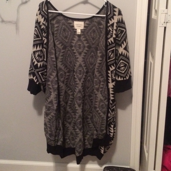 a cardigan sweater/ jacket