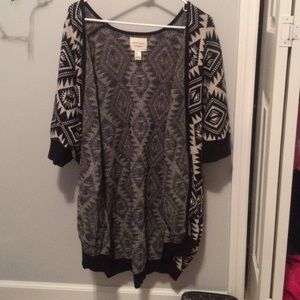 a cardigan sweater/ jacket