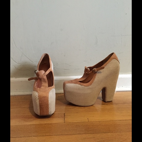 Jeffrey Campbell tan and white platform shoes.