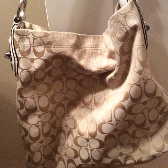 Coach beige and tan shoulder bag.