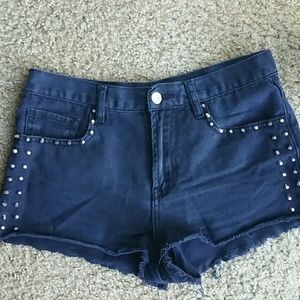 High waisted black studded shorts