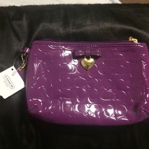 Small purple coach purse /wristlet