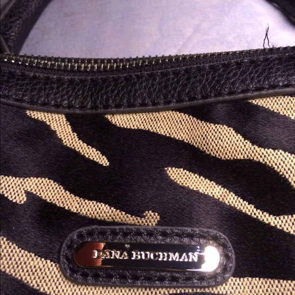 Used hand bag, Dana Buchanan , tiger design .sold
