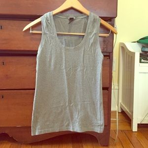 Grey scoop neck tank top with thick straps.
