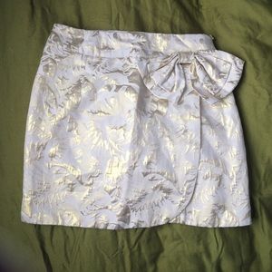 Gold skirt with metallic accents.