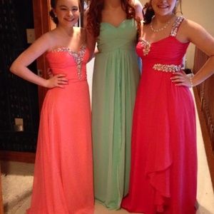 long coral colored formal dress (far left)