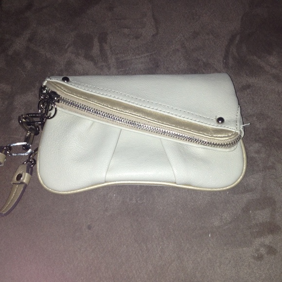 Jennifer Lopez cream wrist purse