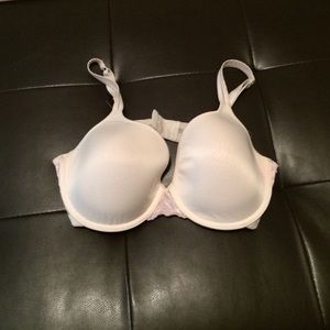 Cream colored bra with pink lace