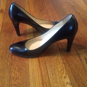 Black leather pumps