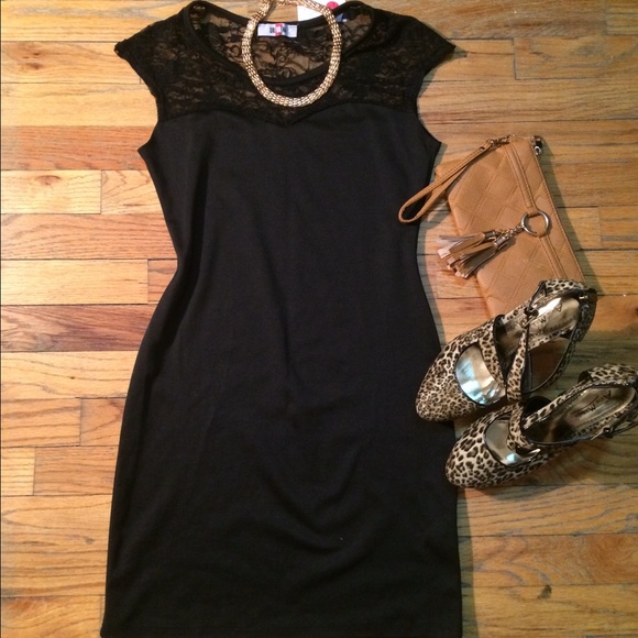Brand new. Black body con dress with lace top.