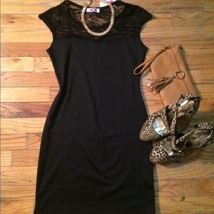 Brand new. Black body con dress with lace top.