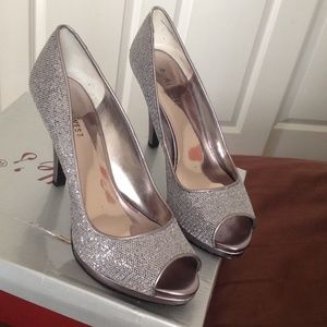 Metallic, silver 4"  heel with 1/2,inch platform