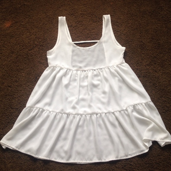 Flowing, backless, white mini dress