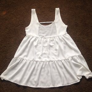 Flowing, backless, white mini dress