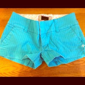 Bright blue shorts with white pinstripes.