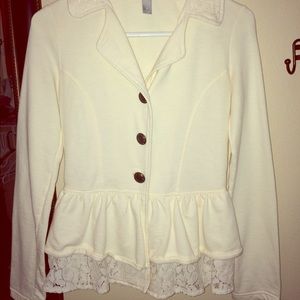 Small cream blazer with lace and bow accent