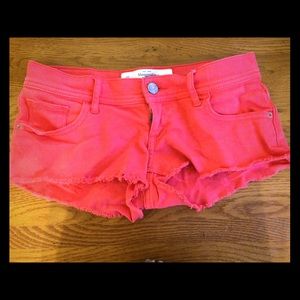 Coral "daisy duke" shorts.
