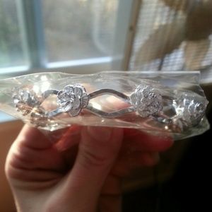 New in package 925 stamped silver rose bangle