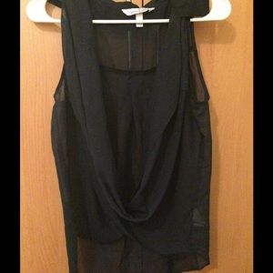 A navy blue chiffon sleeveless top.