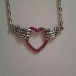 Skeleton hands with heart necklace