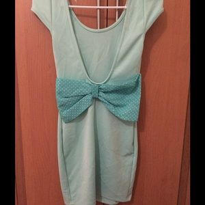 A mint green cocktail dress with bow accent