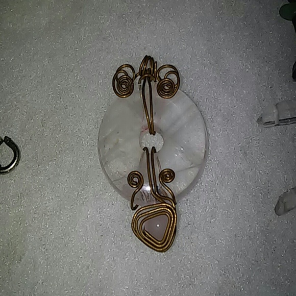 Copper wrapped rose quartz pendant