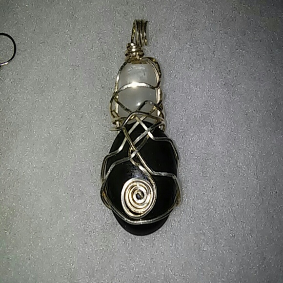 Sterling silver wrapped onyx and quartz pendant