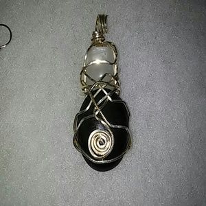 Sterling silver wrapped onyx and quartz pendant