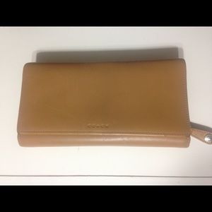 Tan leather Coach wallet.