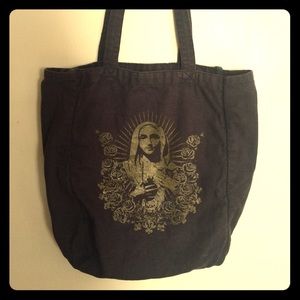 Black tote with gold Virgin Mary detail