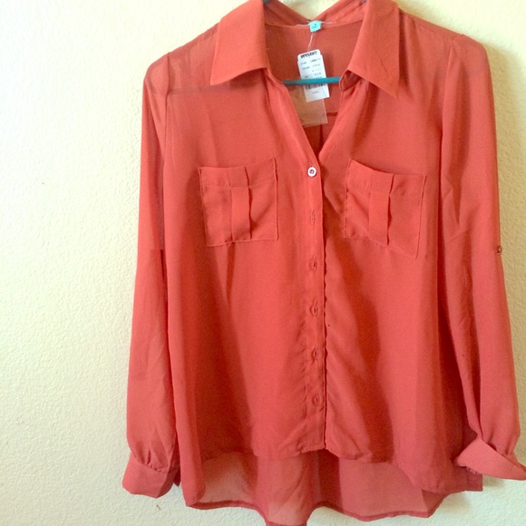 Selling this button up top never worn!