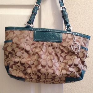 Brown Coach purse with reel edges