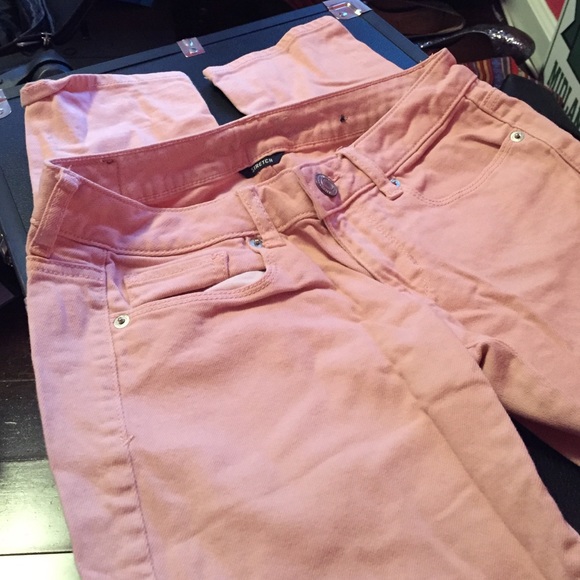 Pale pink skinny jeans