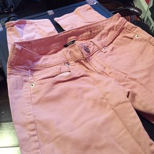 Pale pink skinny jeans