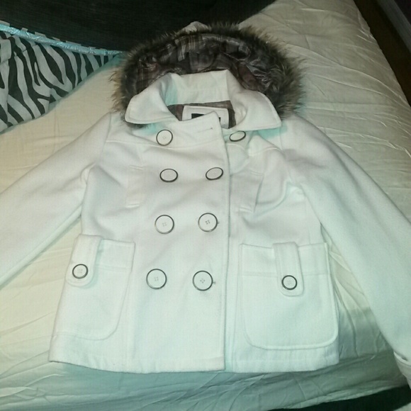 White coat with fur hood.