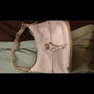 White with gold accents purse