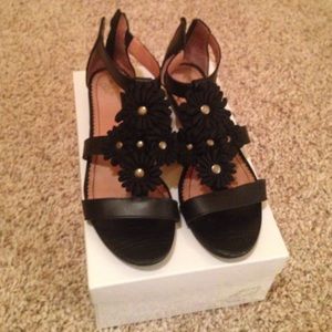 Black leather with flower appliqué sandals